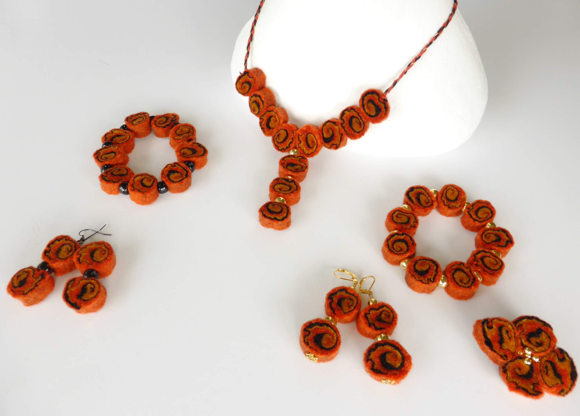 Orange Felt Spiral Jewellery by Andrea McCallum