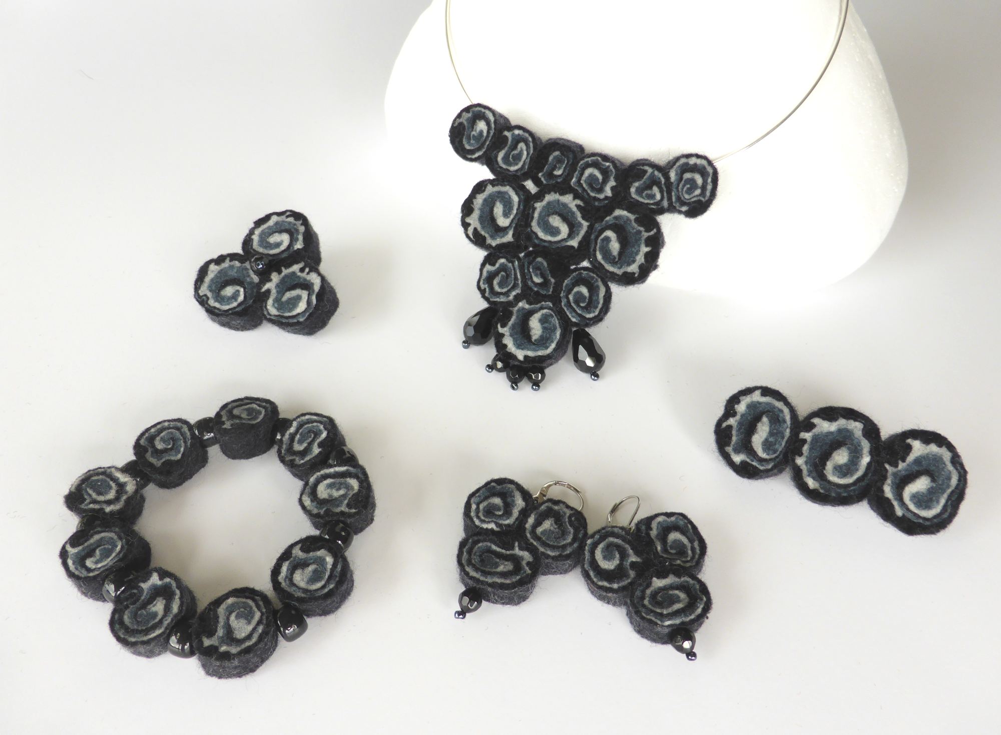 Black felt spiral jewellery necklace (2015) by Andrea McCallum